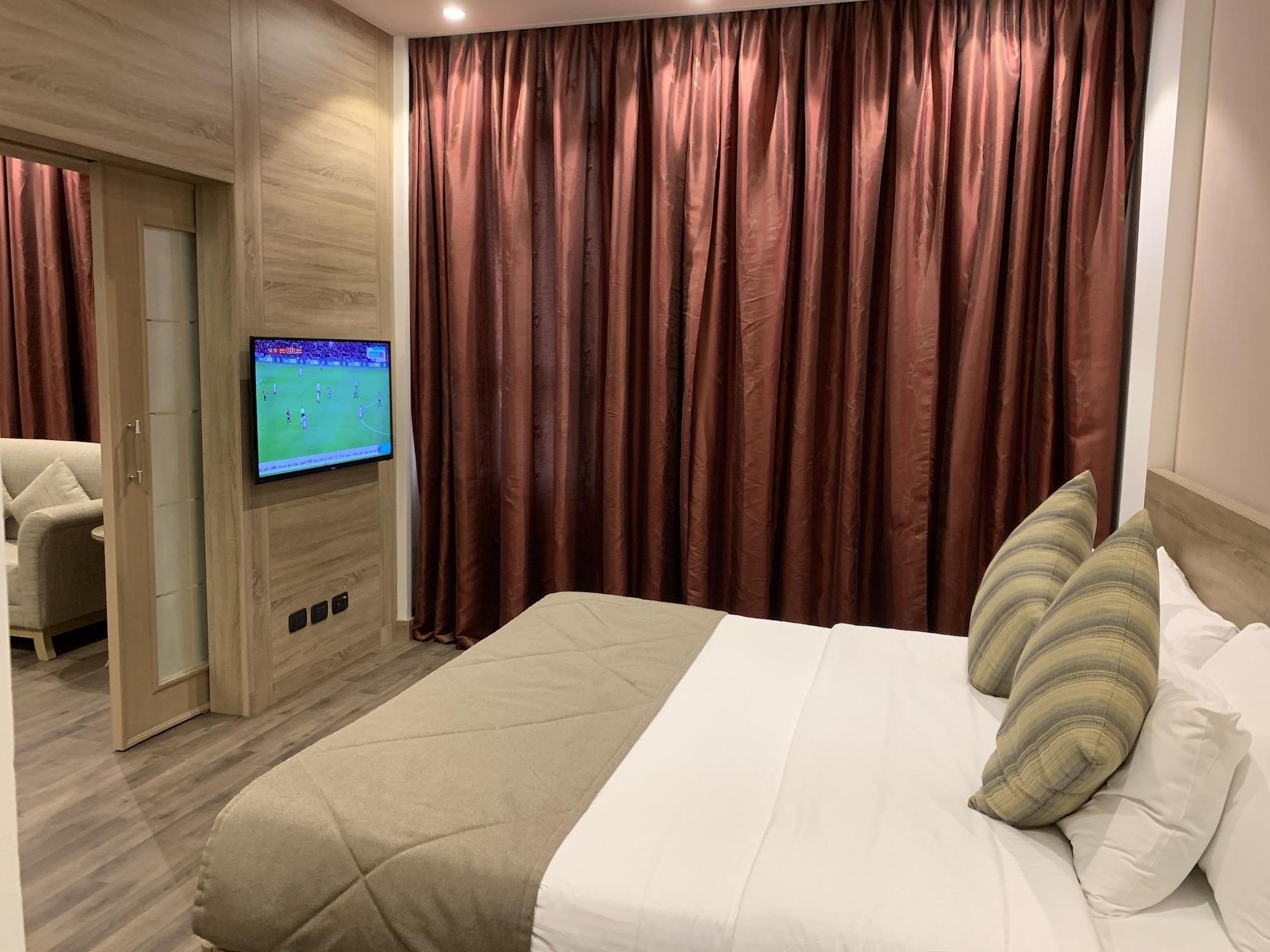 Carlton Al Moaibed Hotel Dammam Exteriér fotografie A bedroom in the hotel